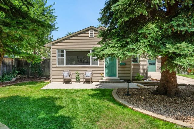 a view of a backyard with a sitting area