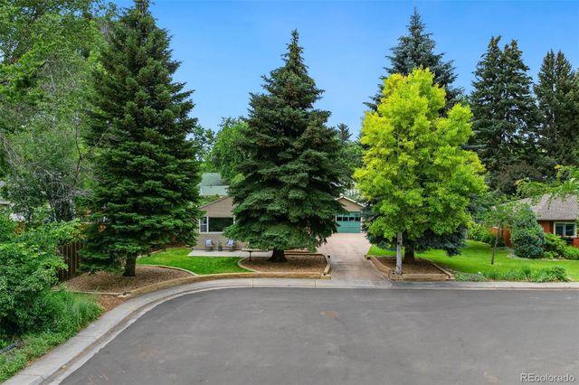 a view of a house with a street