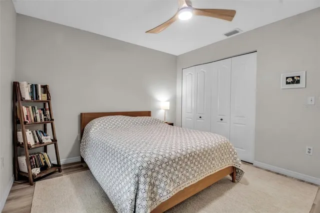 a bedroom with a bed and closet