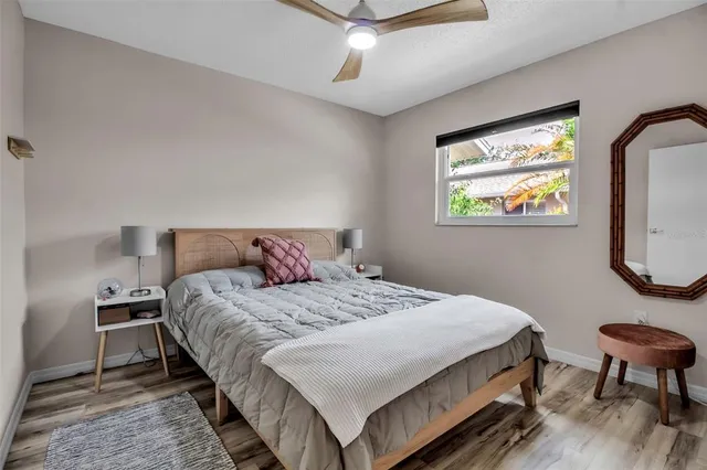 a bedroom with bed and a window