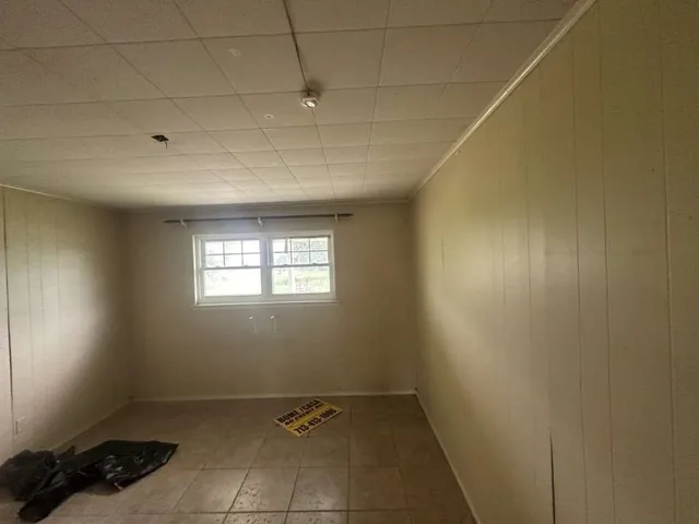 a view of an empty room and window