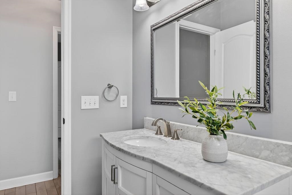 190 Montgomery Road Staunton, VA 24401 - Photo 34 of 46 a bathroom with a granite countertop sink a mirror and vanity