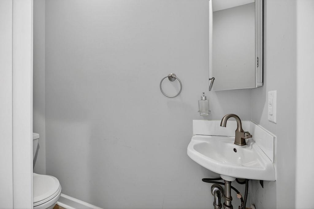 190 Montgomery Road Staunton, VA 24401 - Photo 37 of 46 a bathroom with a sink a toilet and mirror