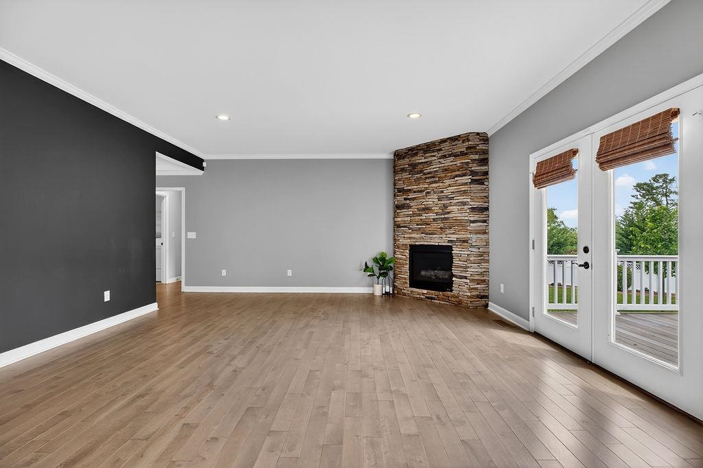 190 Montgomery Road Staunton, VA 24401 - Photo 6 of 46 wooden floor in an empty room with a fireplace