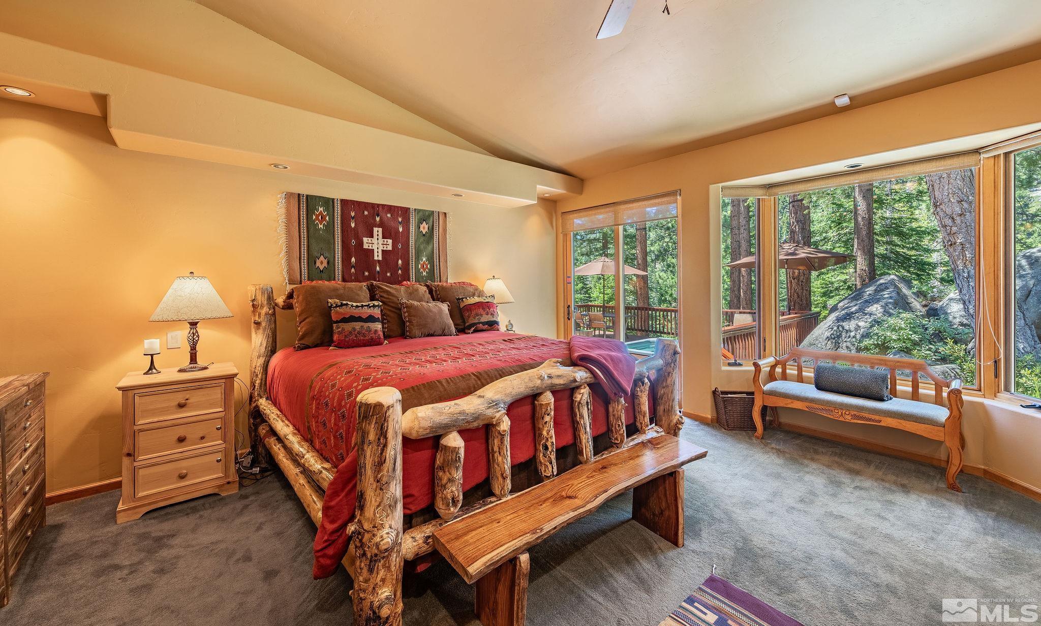 228 Sunflower Circle Stateline, NV 89449 - Photo 14 of 40 a bed room with a bed and a couch