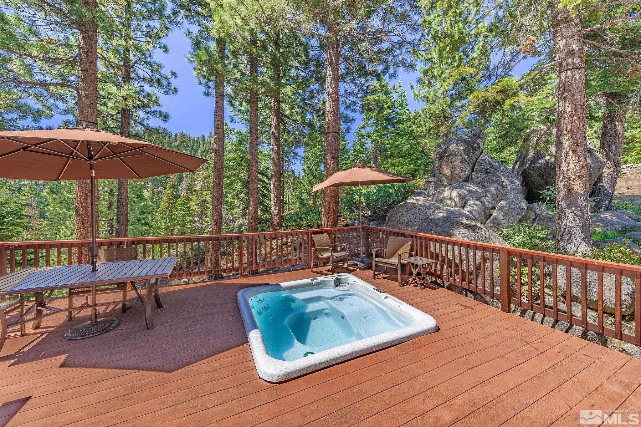 228 Sunflower Circle Stateline, NV 89449 - Photo 2 of 40 a view of balcony with wooden floor and outdoor seating