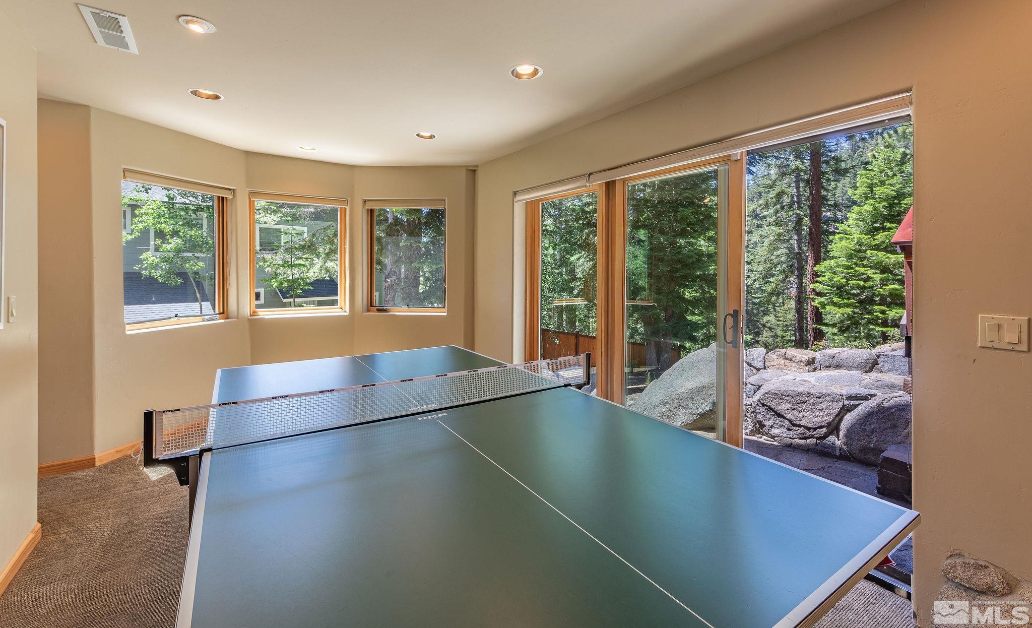 228 Sunflower Circle Stateline, NV 89449 - Photo 22 of 40 a living room with furniture and large windows