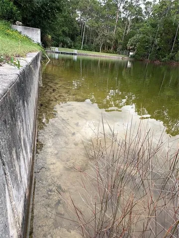 a view of a lake with a yard