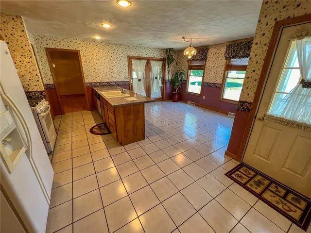 a bed room with a bed and a chandelier