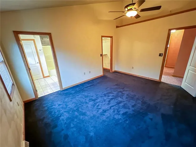 a bathroom with a sink a toilet a mirror and vanity