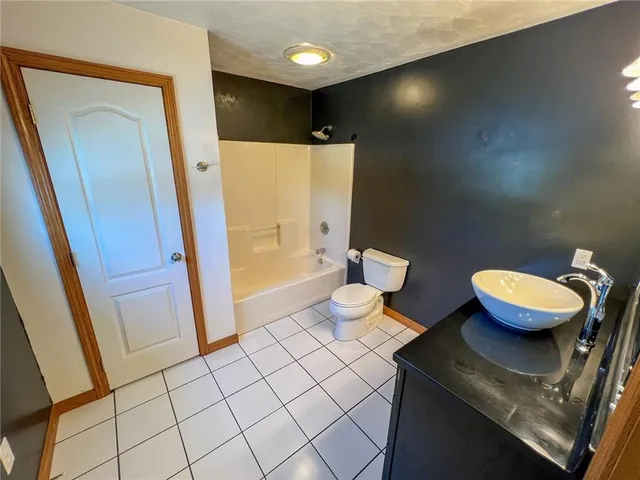 a bathroom with a sink vanity and a mirror