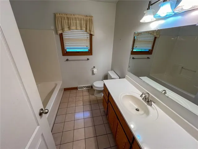a bathroom with a tub and shower