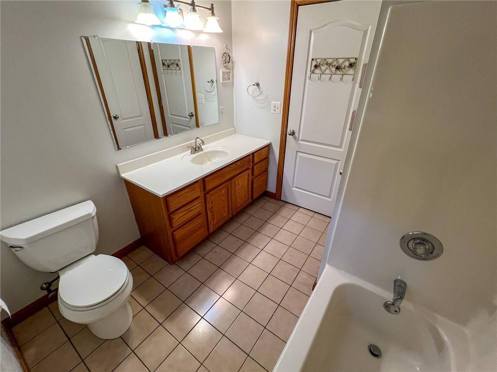 167 Moore Road Butler, PA 16001 - Photo 28 of 50 a bathroom with a sink a toilet and mirror