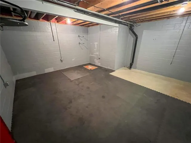 a bathroom with a toilet a sink and a mirror