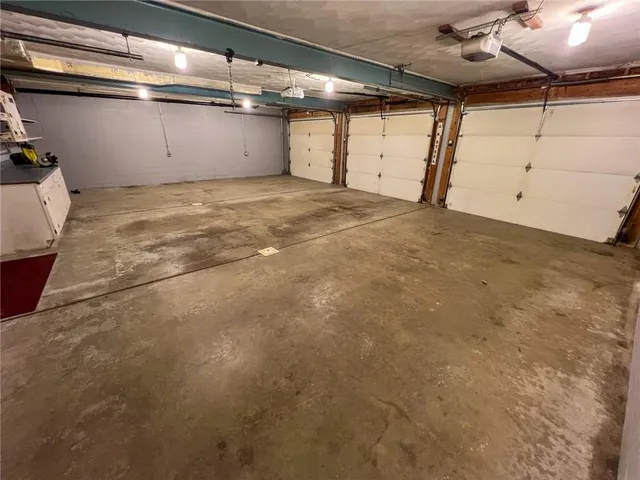 a view of a patio with table and chairs with wooden floor and fence