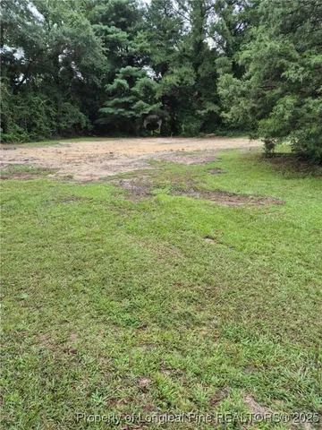 a view of outdoor space with deck and yard