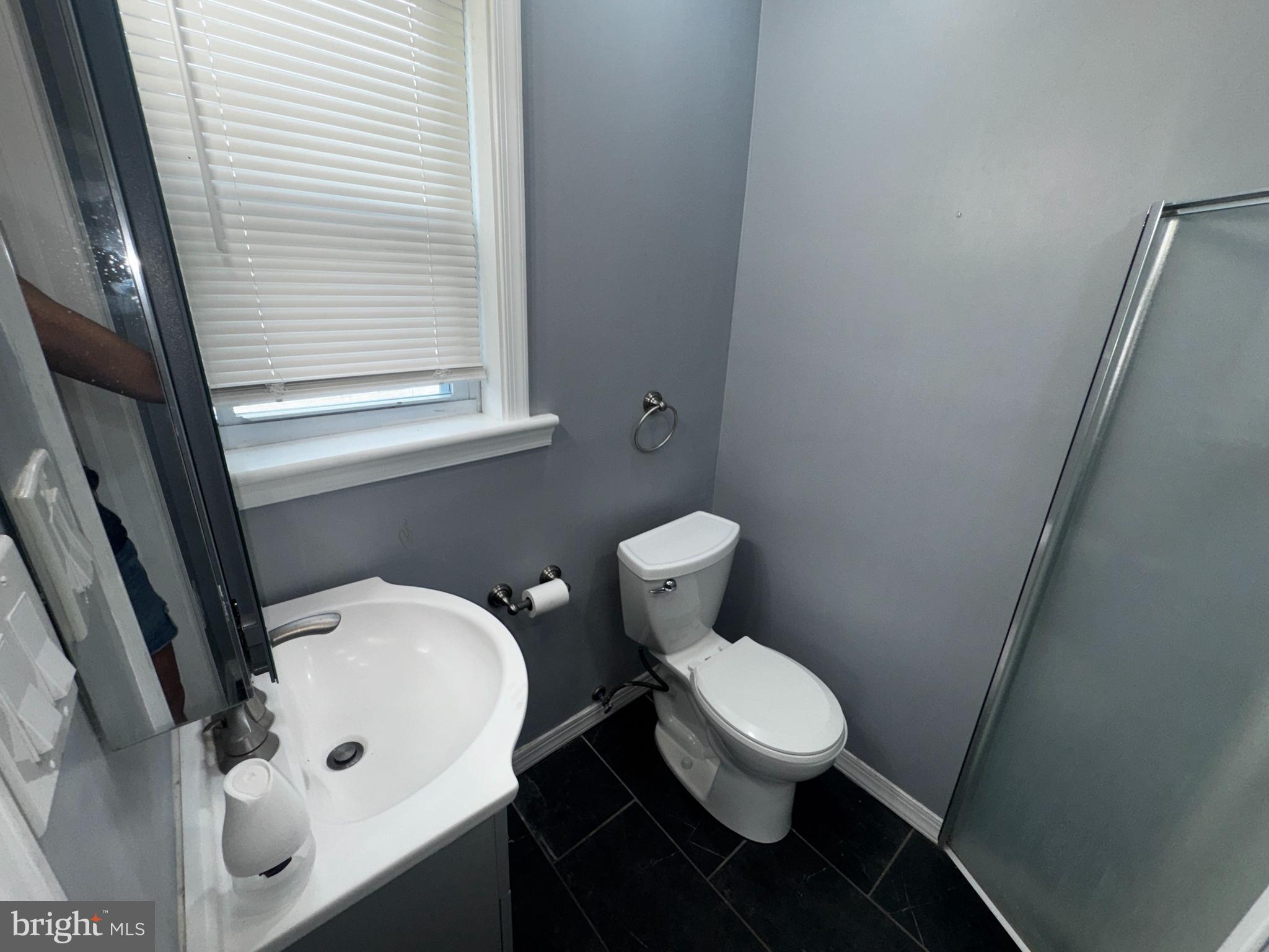 700 Lloyd Street Chester, PA 19013 - Photo 16 of 32 a bathroom with a toilet and a sink