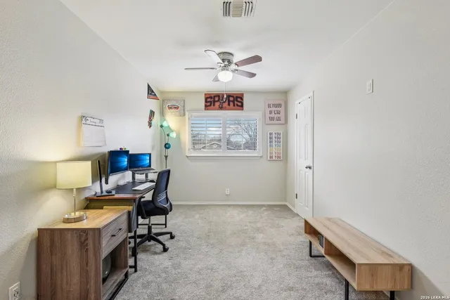a workspace with furniture and window