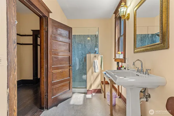 a bathroom with a sink and a mirror