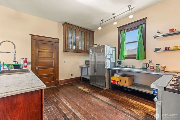 a kitchen with refrigerator and window