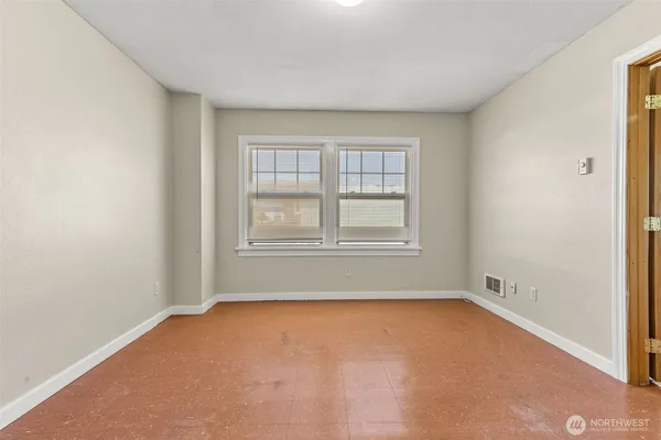 a view of an empty room with a window