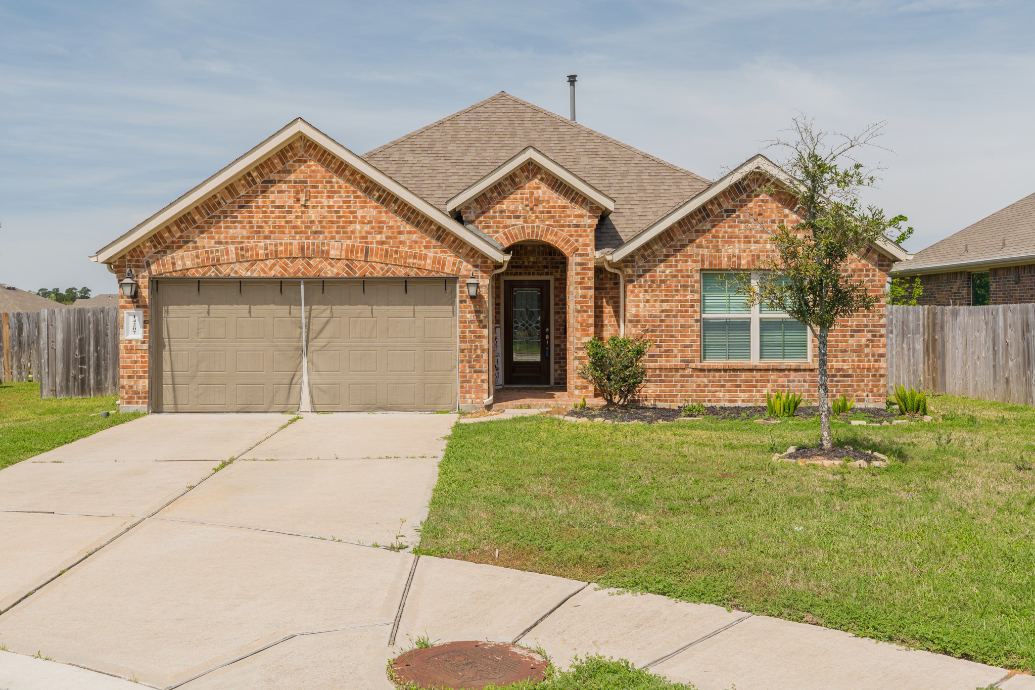 14207 Irvine Rnch Trail Conroe, TX 77384 - Photo 1 of 29 front view of a house with a yard