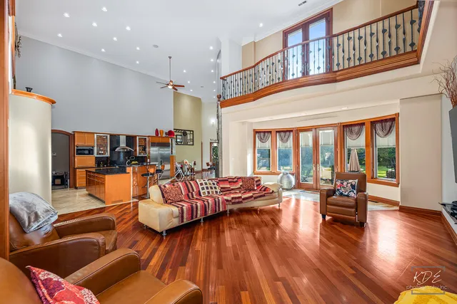 a bathroom with a sink a bathtub and a large mirror