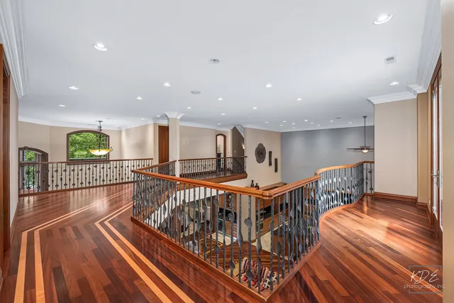 a kitchen with stainless steel appliances granite countertop a stove top oven a sink and a refrigerator