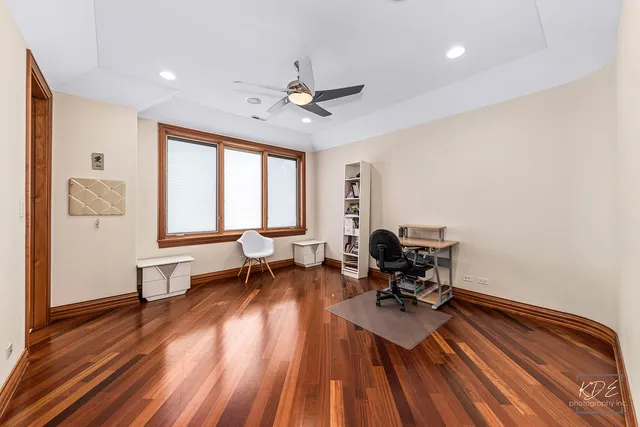 an aerial view of a house with outdoor space lake view and a yard