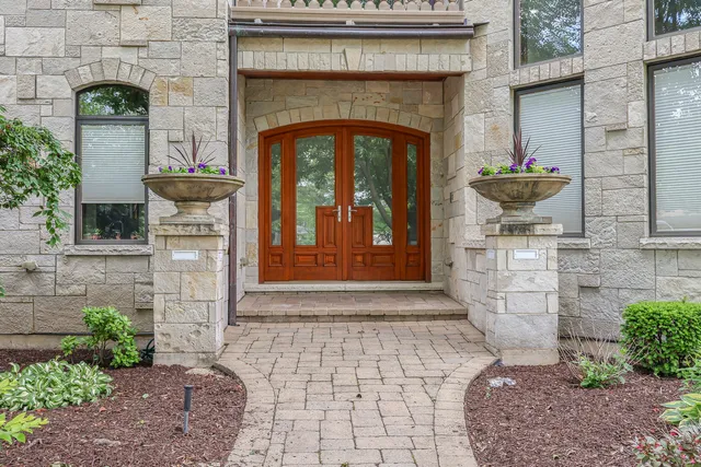 a view of a room with wooden floor and couches