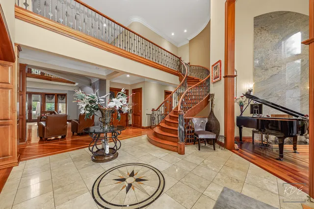 a view of staircase with furniture and a potted plant