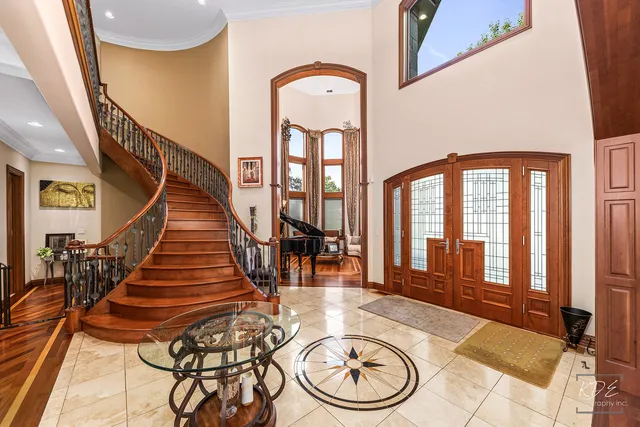 a kitchen with stainless steel appliances granite countertop a sink counter space cabinets and a view of living room
