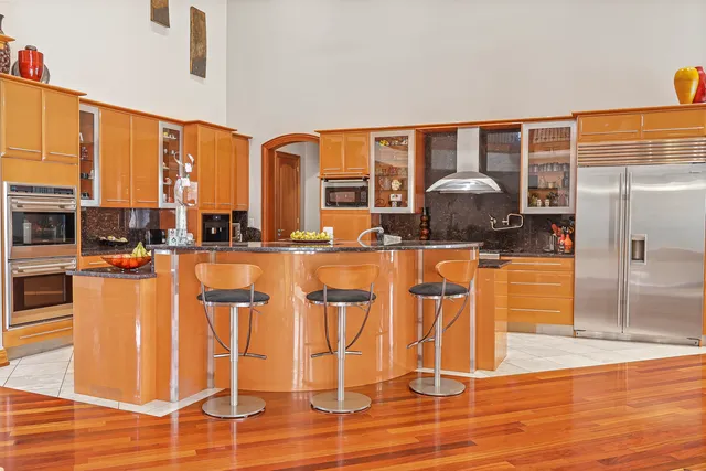 a bathroom with a toilet a sink and a mirror