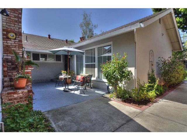 807 Haverhill Drive Sunnyvale, CA 94087 - Photo 18 of 20 a view of a patio with table and chairs under an umbrella