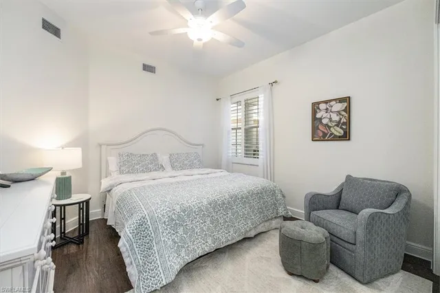 a bedroom with bed and a window