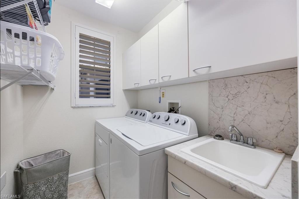 730 Regency Reserve Circle, Unit 2802 Naples, FL 34119 - Photo 13 of 22 a utility room with dryer and washer