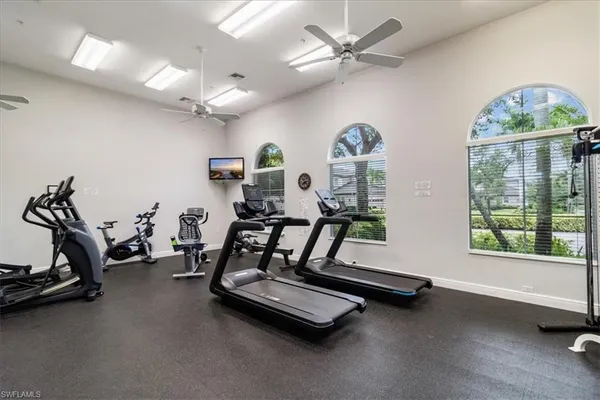 a room with gym equipment and a large window