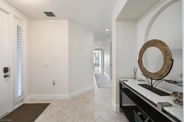 a view of a bathroom with a sink and a mirror