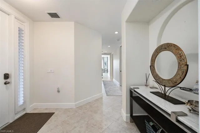 a view of a bathroom with a sink and a mirror