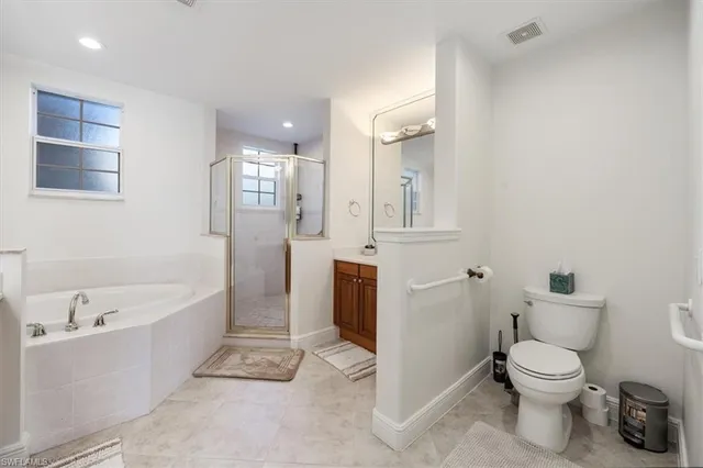 a bathroom with a bathtub toilet and a sink