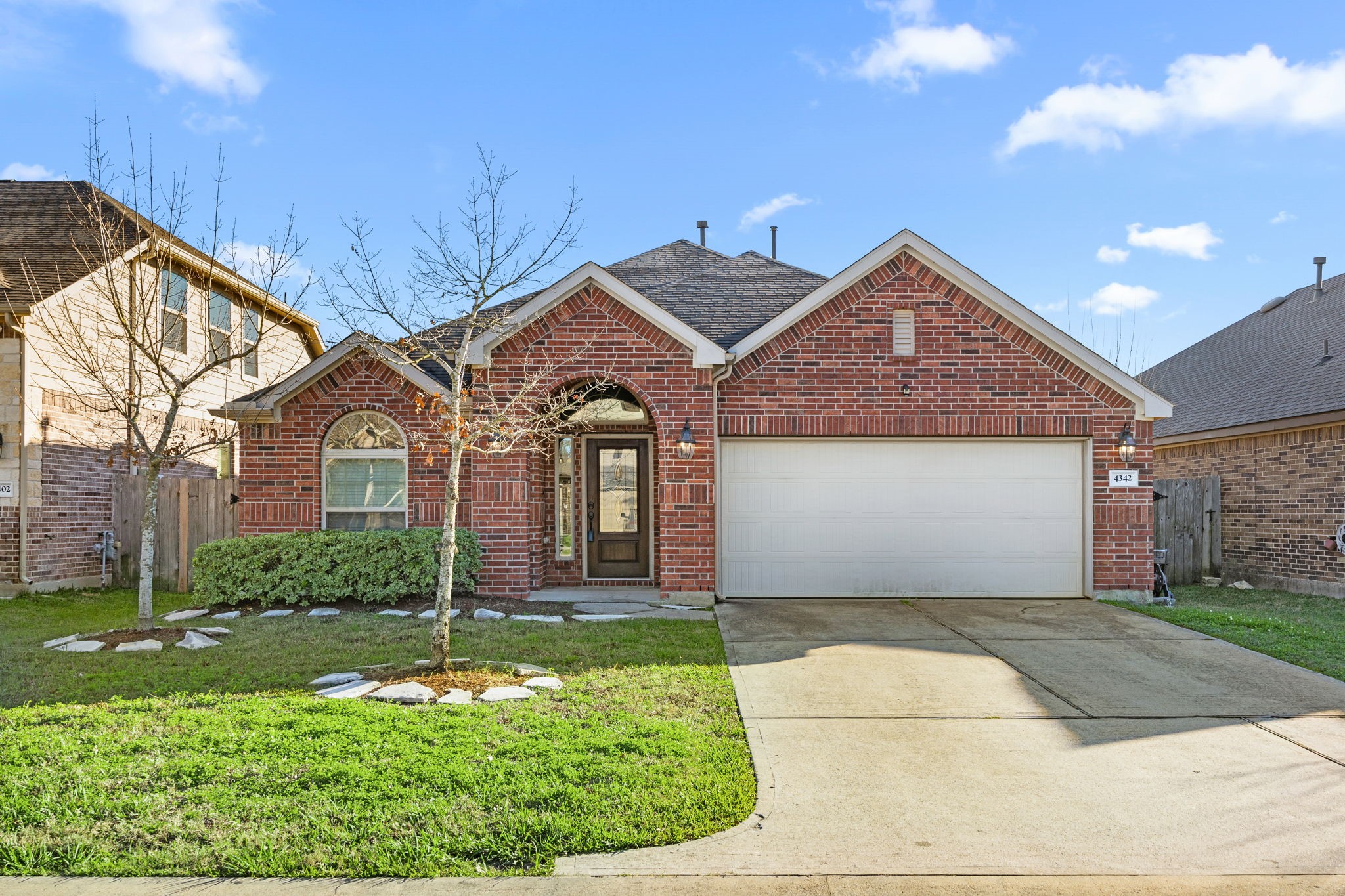 4342 Ambrosia Lane Baytown, TX 77521 - Photo 1 of 34 a front view of a house with a yard and garage