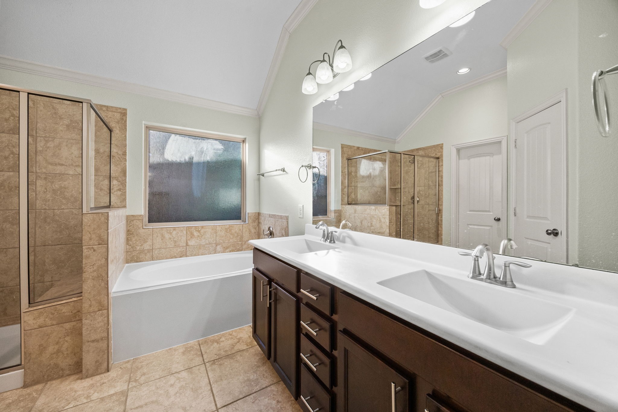 4342 Ambrosia Lane Baytown, TX 77521 - Photo 19 of 34 a bathroom with a sink double vanity granite tub shower and a mirror