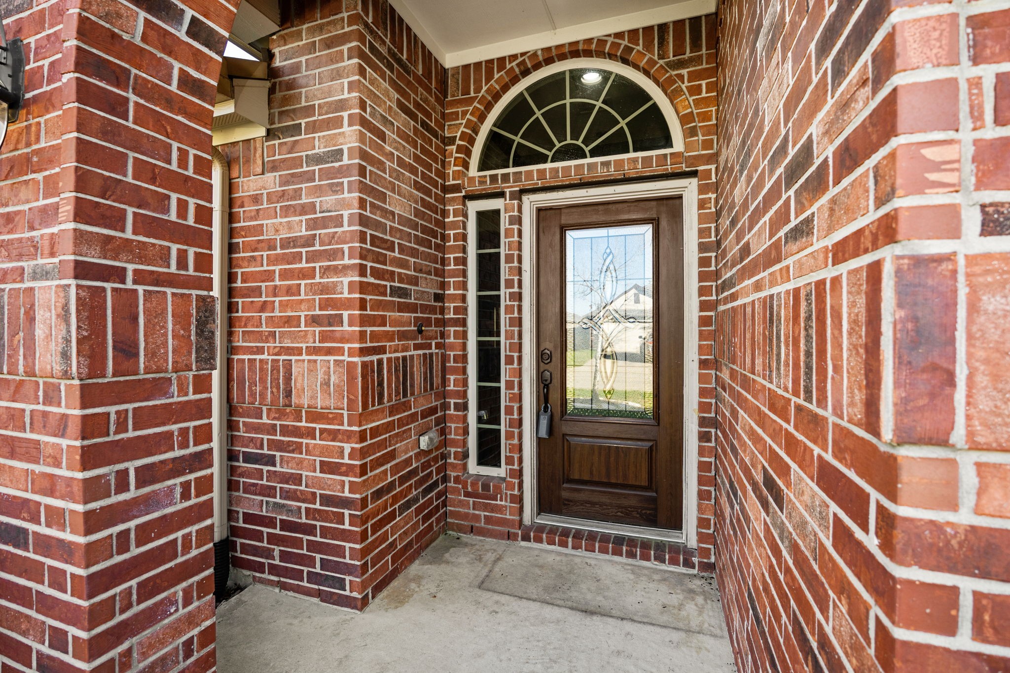 4342 Ambrosia Lane Baytown, TX 77521 - Photo 2 of 34 a view of a brick building with many windows