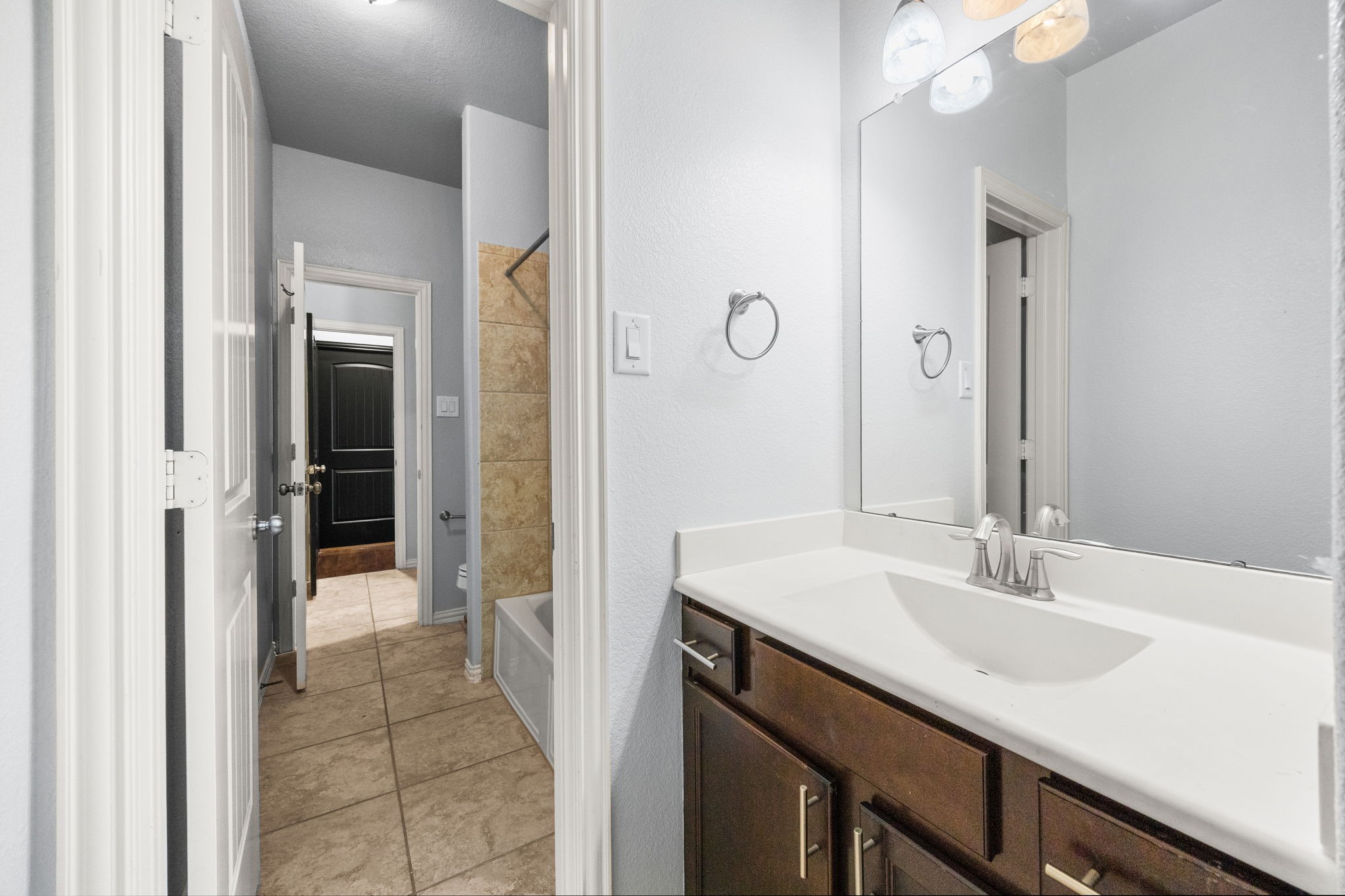 4342 Ambrosia Lane Baytown, TX 77521 - Photo 25 of 34 a bathroom with a sink and a mirror