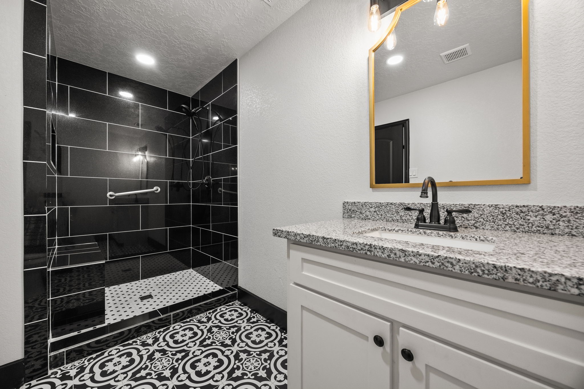 4342 Ambrosia Lane Baytown, TX 77521 - Photo 29 of 34 a bathroom with a sink and a mirror