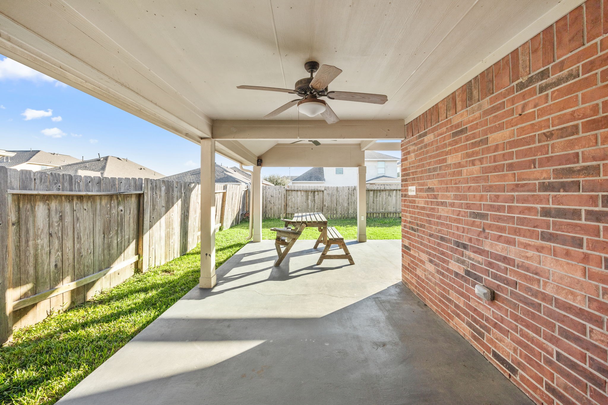 4342 Ambrosia Lane Baytown, TX 77521 - Photo 31 of 34 a view of a patio with a table and chairs