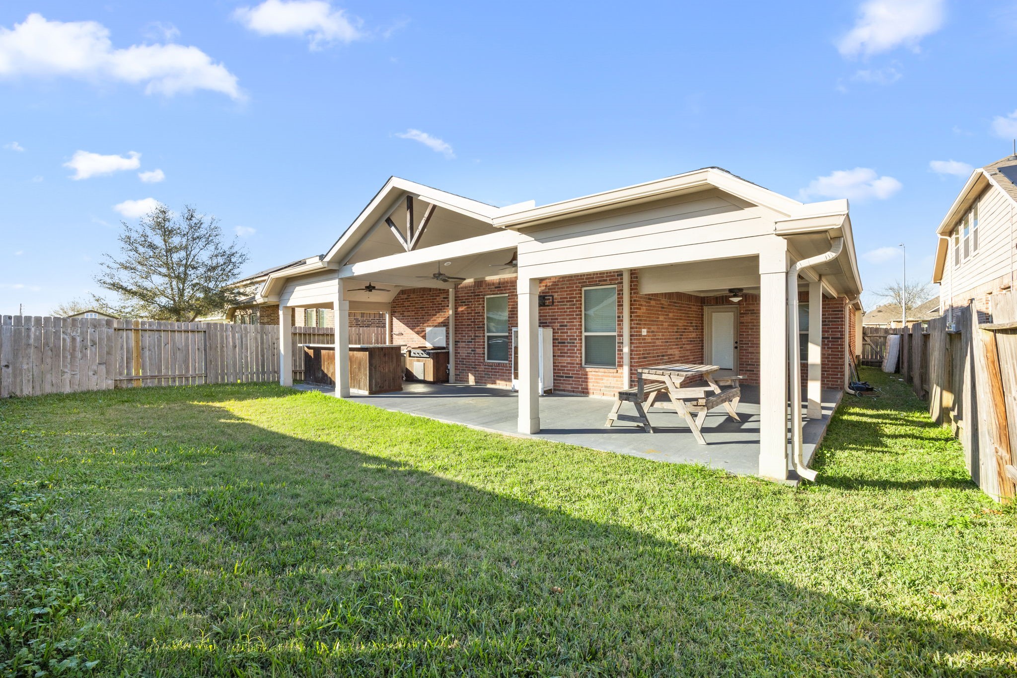 4342 Ambrosia Lane Baytown, TX 77521 - Photo 33 of 34 a view of a house with backyard porch and sitting area