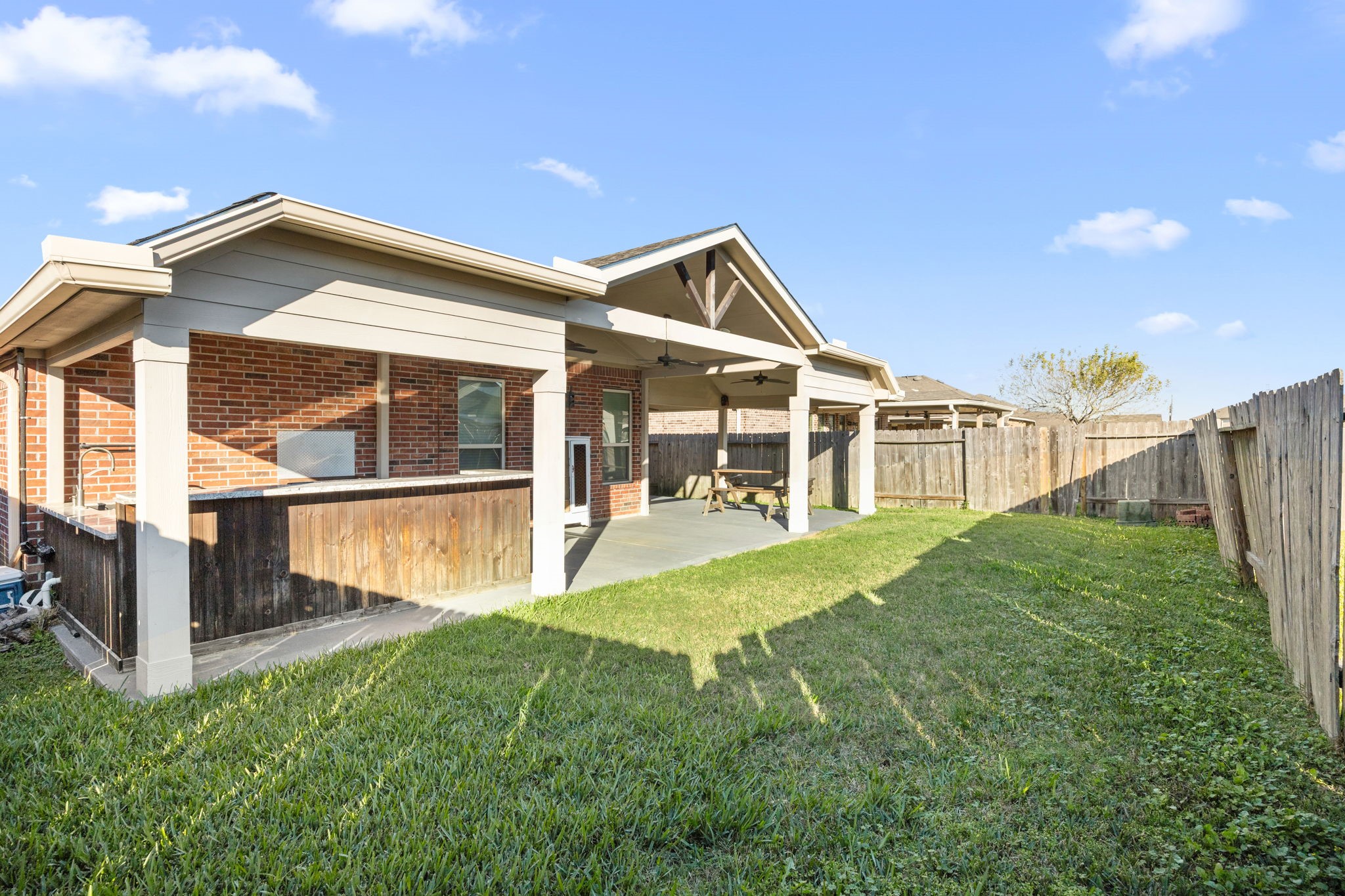 4342 Ambrosia Lane Baytown, TX 77521 - Photo 34 of 34 a view of a house with backyard and porch