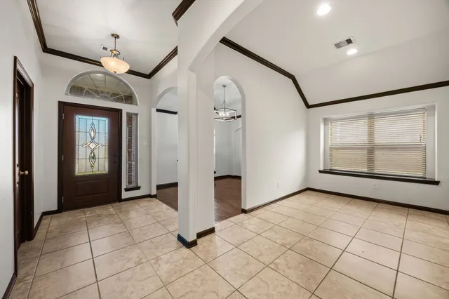 a view of a livingroom with an empty space and window