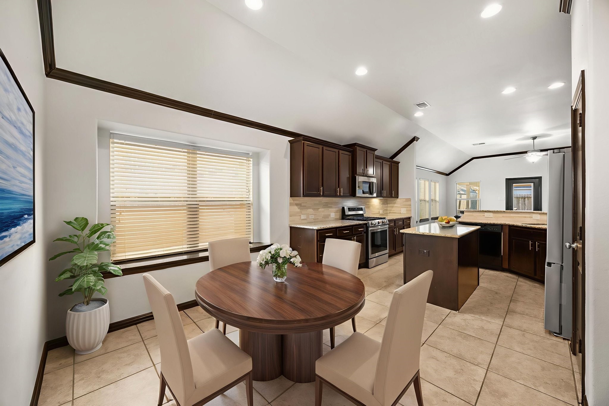 4342 Ambrosia Lane Baytown, TX 77521 - Photo 7 of 34 a kitchen with a table chairs sink and cabinets